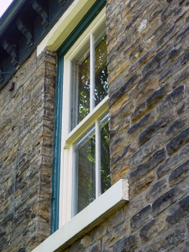 Keeping the original windows in a Victorian house retains the character